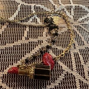 Betsey Johnson lipstick necklace.